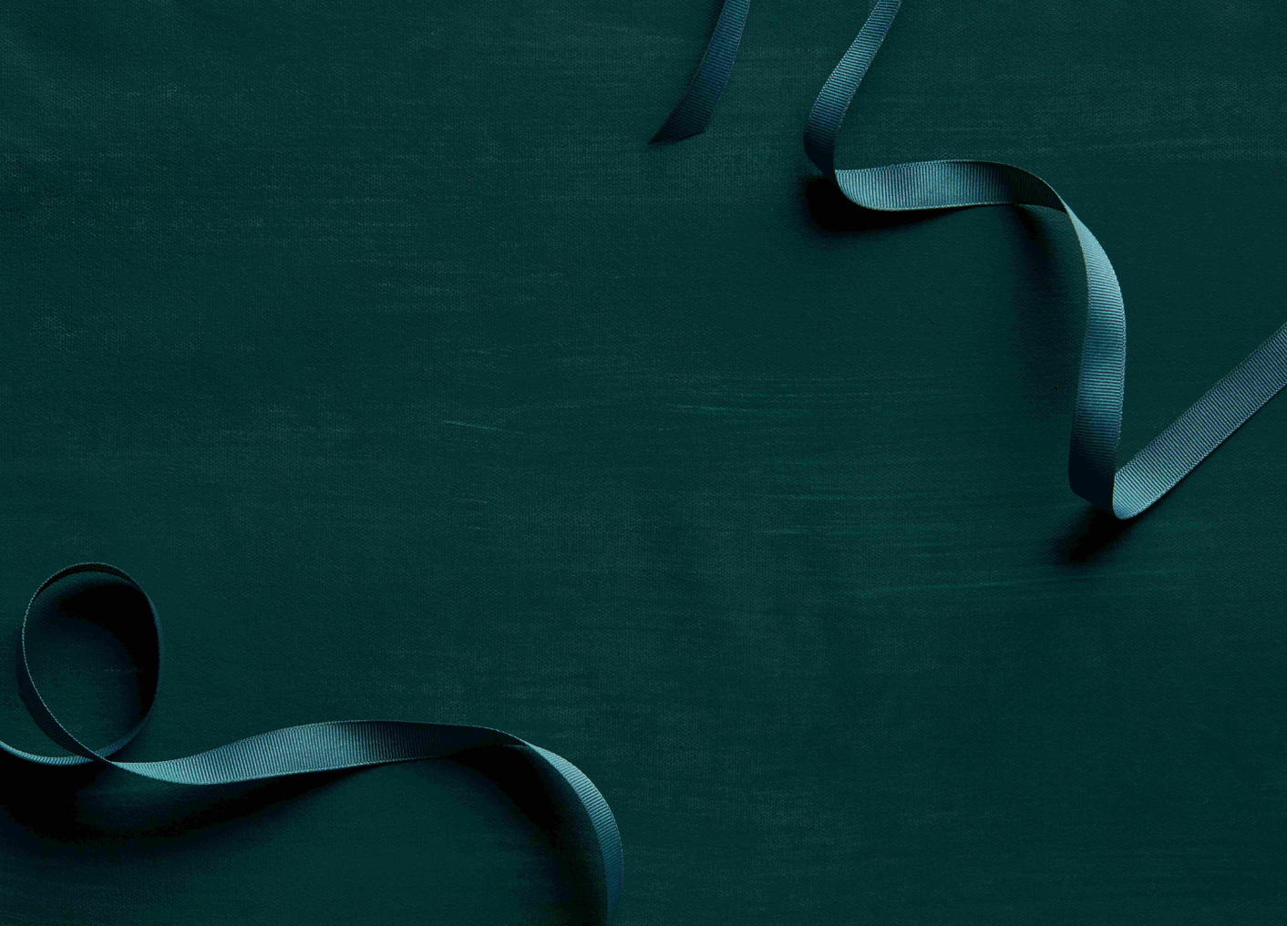 Dark green ribbon on a textured dark green background