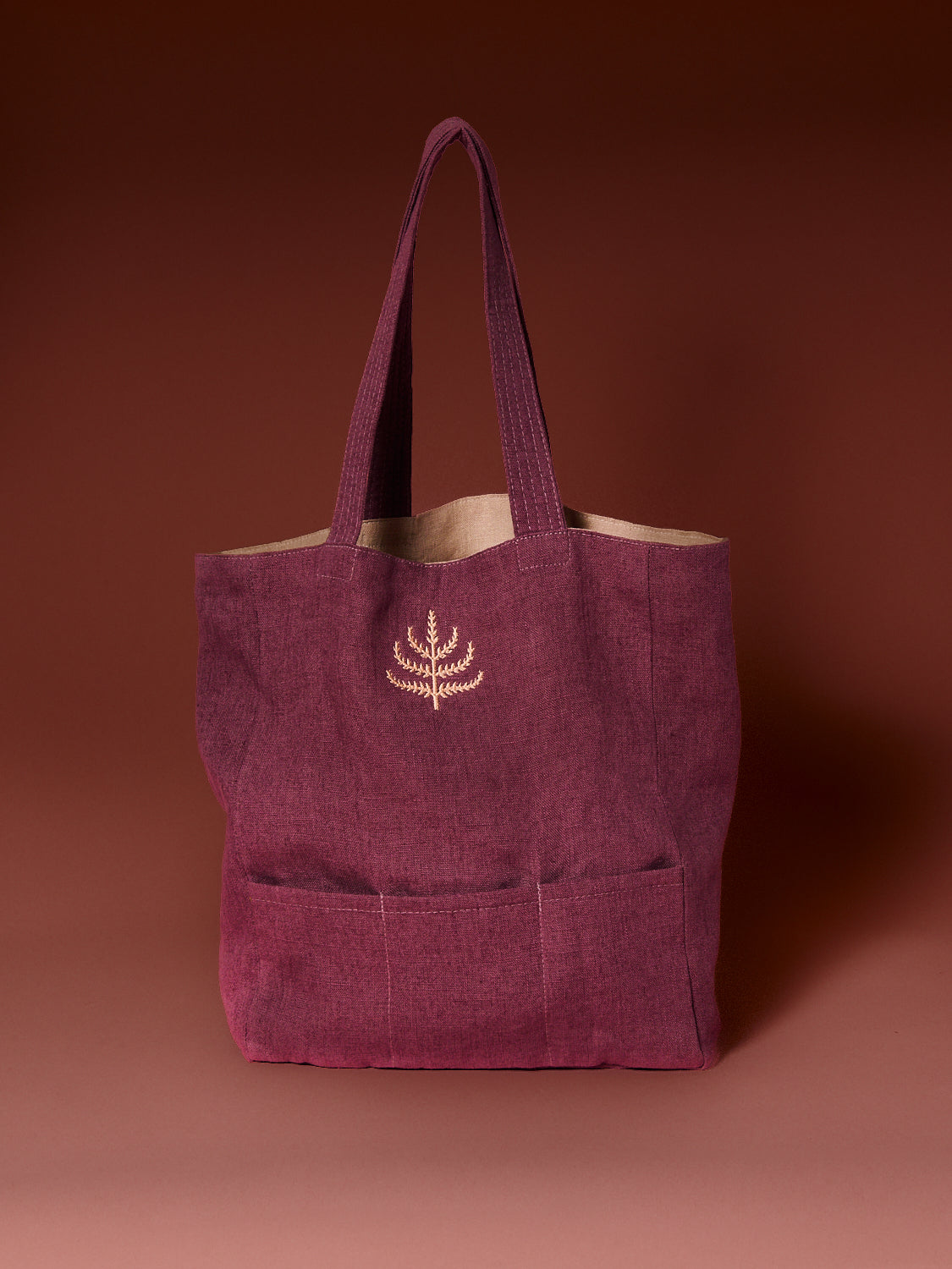 Mulberry tote bag designed with three chocolate compartments and a mulberry tree embroidered logo.