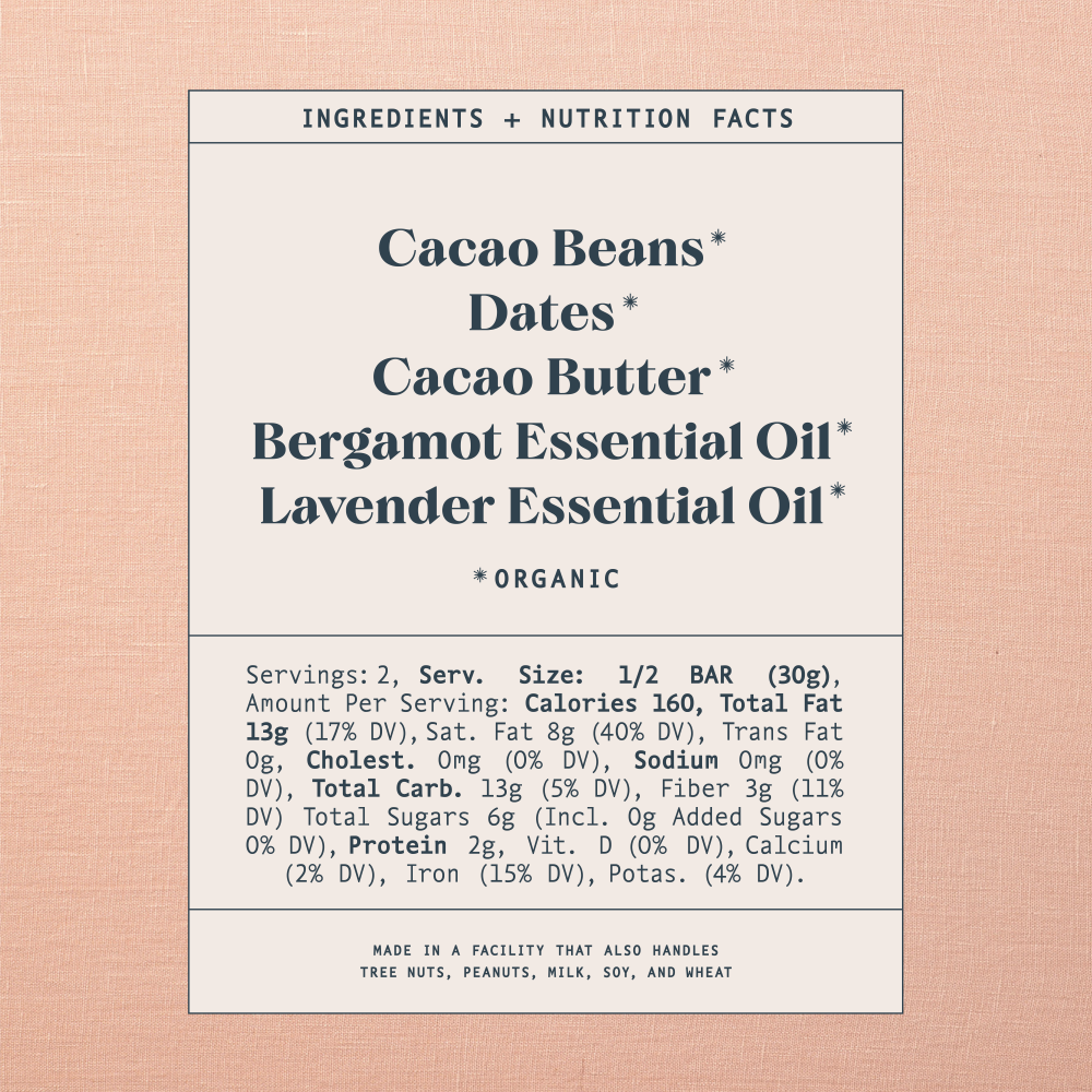 List of ingredients and nutrition facts on a warm brown background. Ingredients list contains: Cacao Beans*, Dates*, Cacao Butter*, Bergamot Essential Oil*, 
Lavender Essential Oil*. Astricts indicate organic products. Made in a facility that also handles tree nuts, peanuts, milk, soy and wheat.