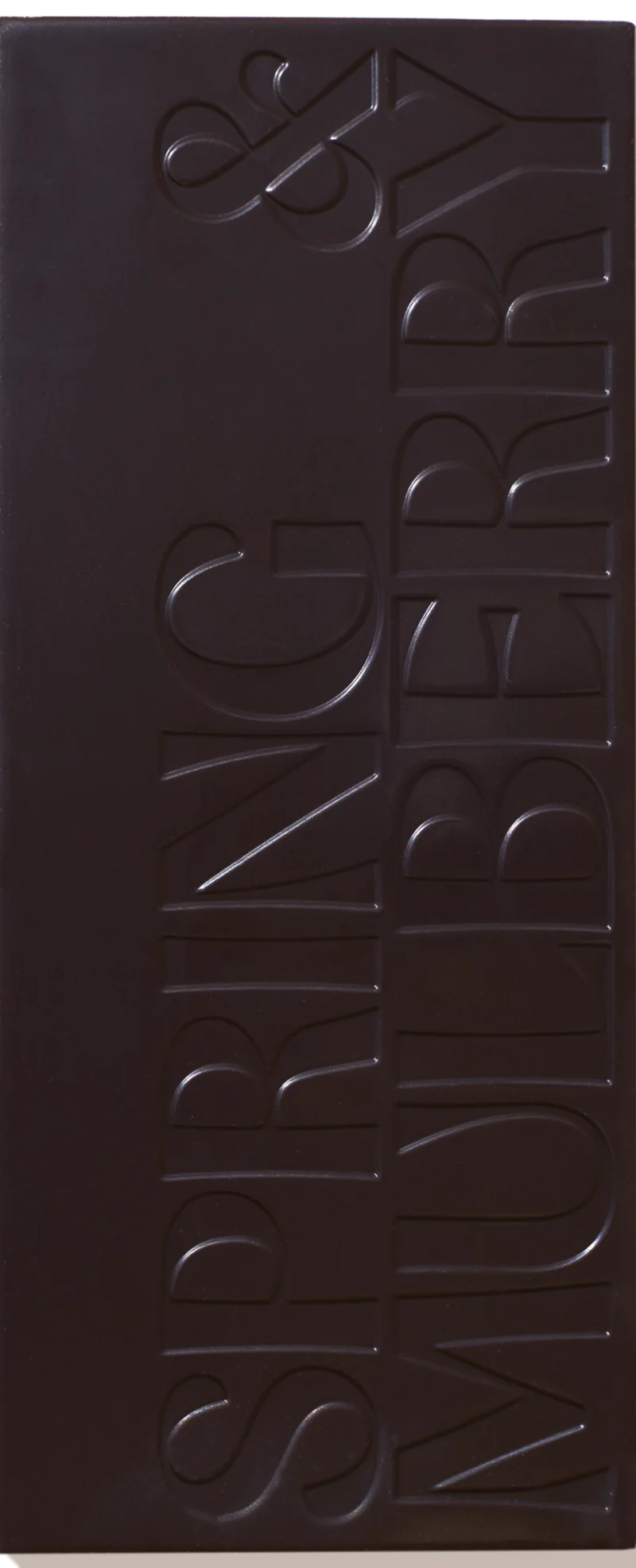 Unwrapped Spring & Mulberry Blood Orange chocolate bar embossed with the Spring & Mulberry logo