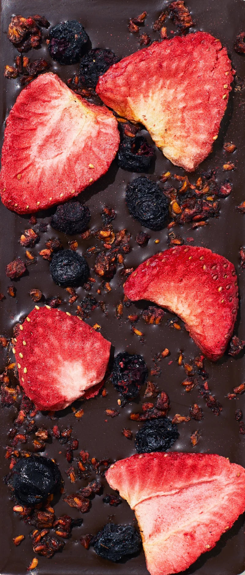 Unwrapped Spring & Mulberry Mixed Berry dark chocolate bar topped with dried berries